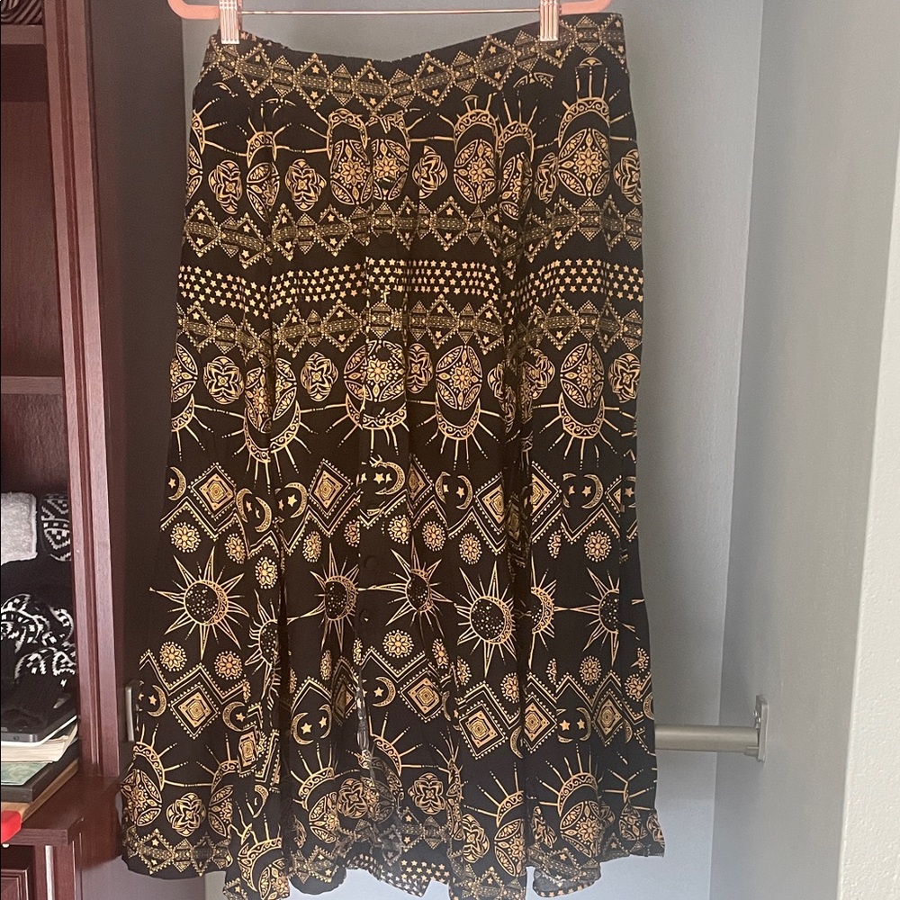 Midi skirt with black and gold witchy pattern